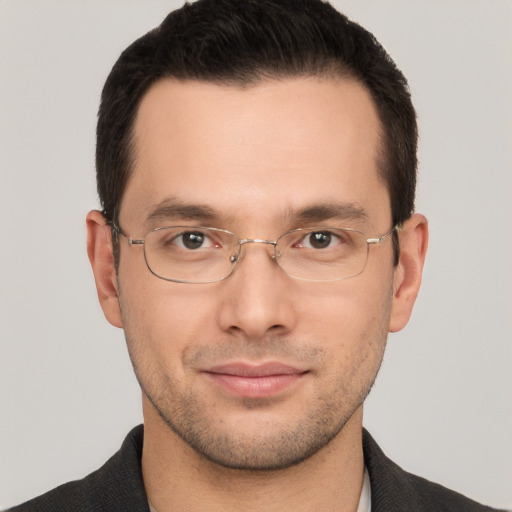 Joyful white adult male with short  brown hair and brown eyes