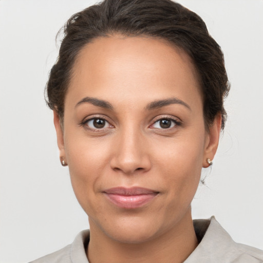 Joyful white young-adult female with short  brown hair and brown eyes