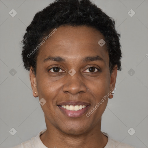 Joyful black young-adult female with short  black hair and brown eyes