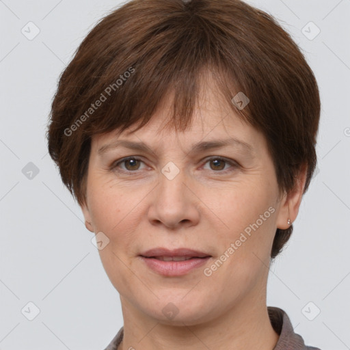 Joyful white adult female with short  brown hair and grey eyes