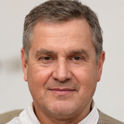 Joyful white middle-aged male with short  brown hair and brown eyes