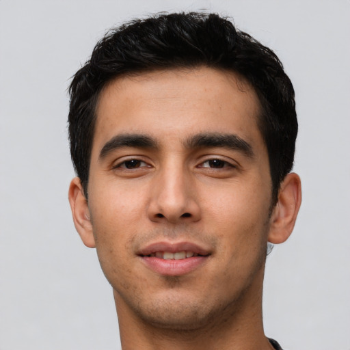 Joyful asian young-adult male with short  black hair and brown eyes