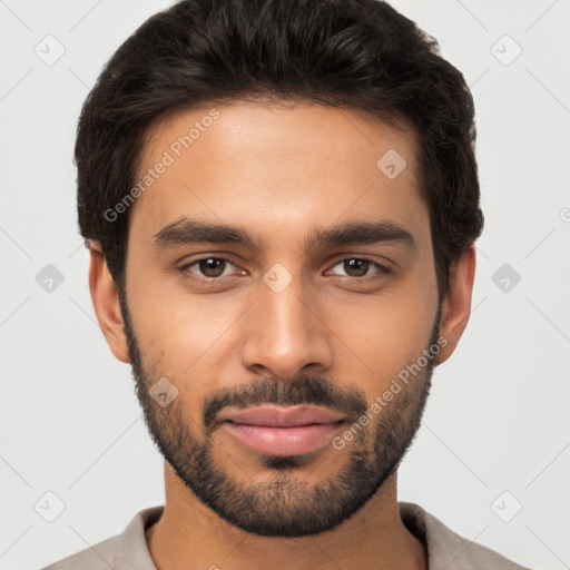 Joyful black young-adult male with short  brown hair and brown eyes