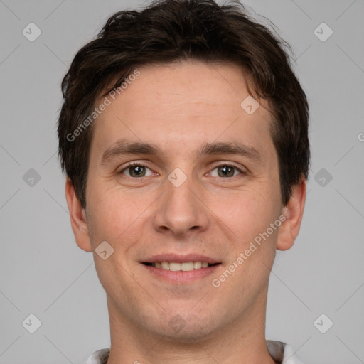 Joyful white young-adult male with short  brown hair and brown eyes