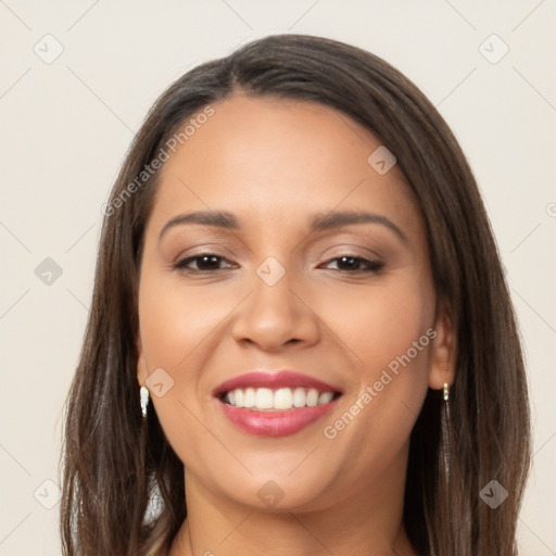 Joyful latino young-adult female with long  brown hair and brown eyes