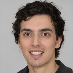 Joyful white young-adult male with medium  brown hair and brown eyes