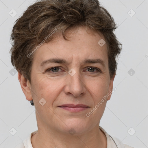 Joyful white adult female with short  brown hair and brown eyes