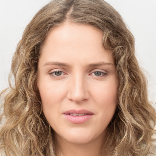 Joyful white young-adult female with long  brown hair and green eyes