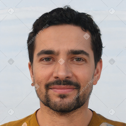 Joyful latino young-adult male with short  black hair and brown eyes