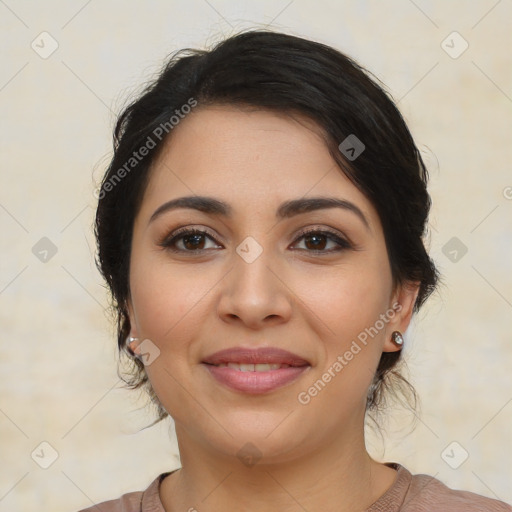 Joyful latino young-adult female with medium  brown hair and brown eyes