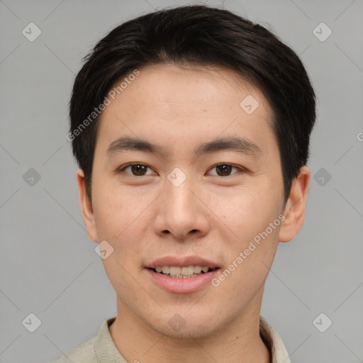 Joyful asian young-adult male with short  brown hair and brown eyes