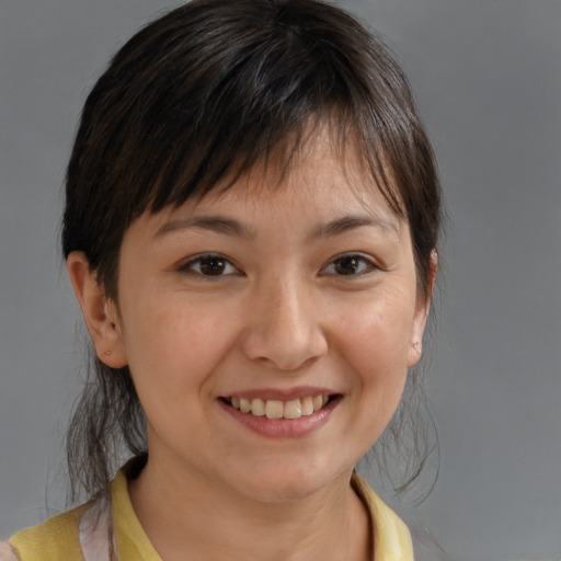 Joyful white young-adult female with medium  brown hair and brown eyes