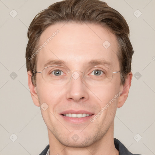 Joyful white adult male with short  brown hair and grey eyes