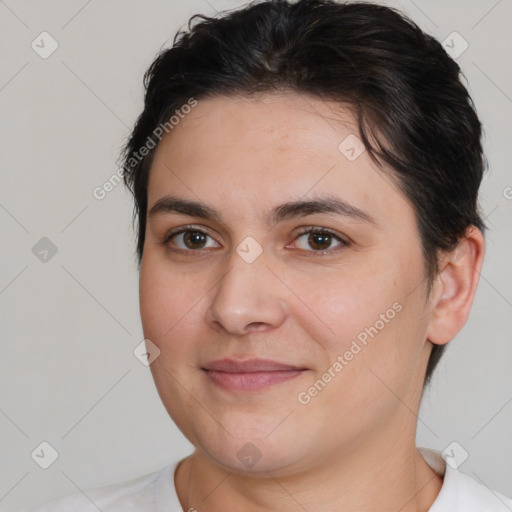 Joyful white young-adult female with short  brown hair and brown eyes