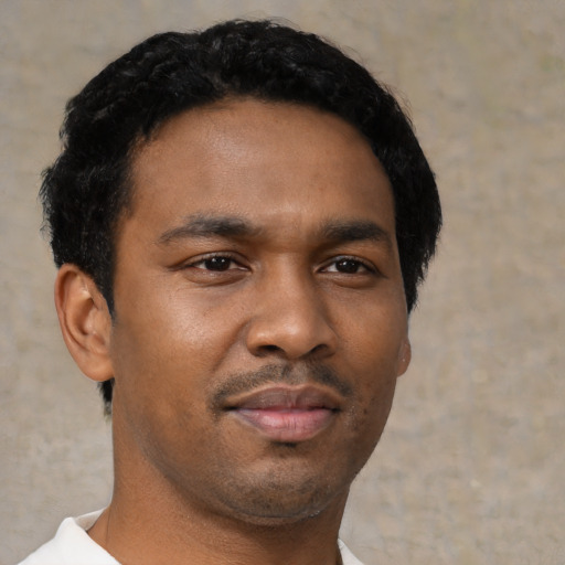 Neutral black young-adult male with short  black hair and brown eyes