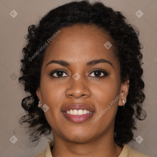 Joyful black young-adult female with long  brown hair and brown eyes