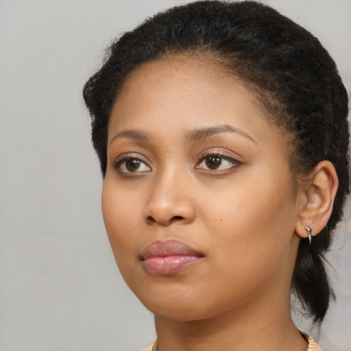 Neutral black young-adult female with long  brown hair and brown eyes