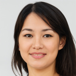 Joyful asian young-adult female with long  brown hair and brown eyes