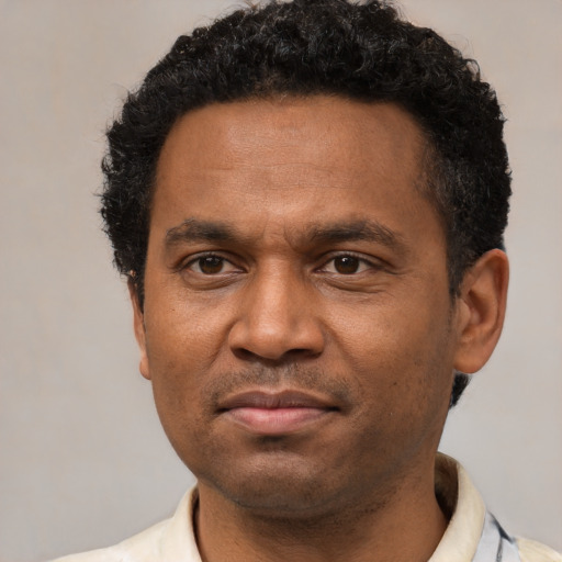 Neutral latino adult male with short  black hair and brown eyes