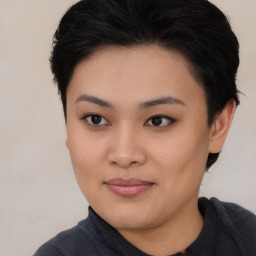 Joyful asian young-adult female with short  black hair and brown eyes