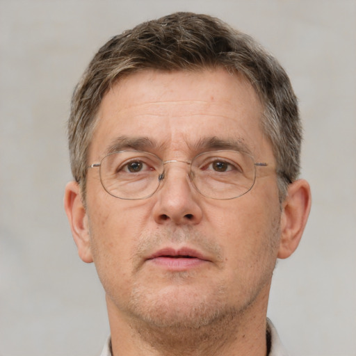 Neutral white middle-aged male with short  brown hair and brown eyes