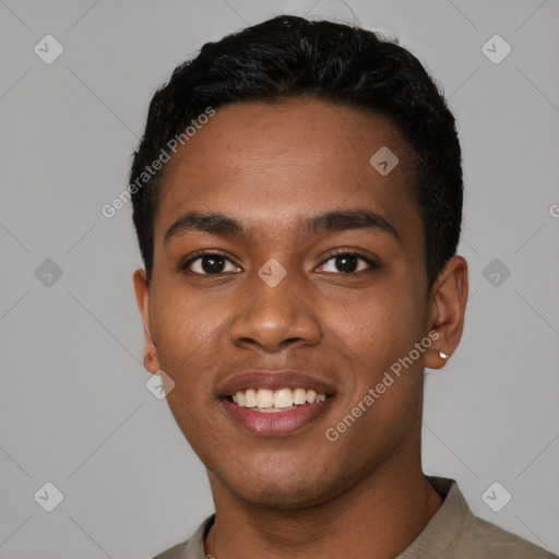 Joyful black young-adult male with short  black hair and brown eyes