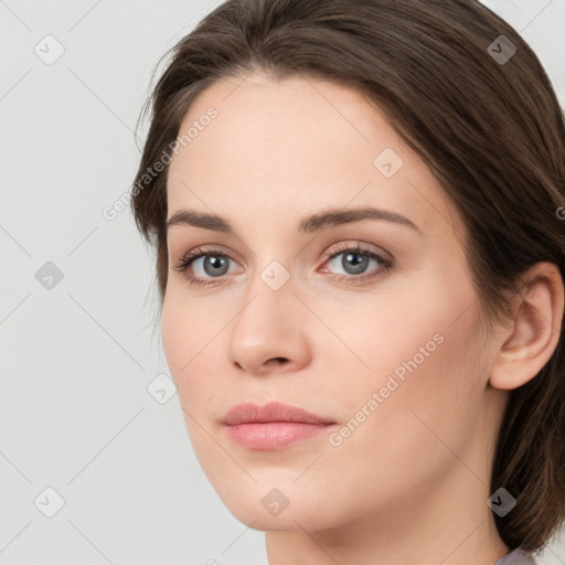 Joyful white young-adult female with long  brown hair and green eyes