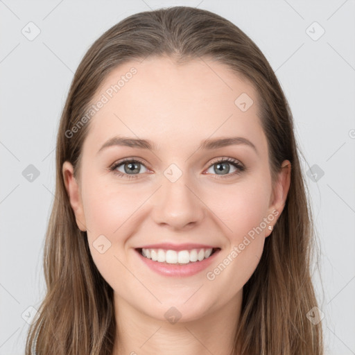 Joyful white young-adult female with long  brown hair and grey eyes