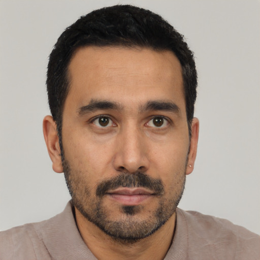 Neutral latino young-adult male with short  black hair and brown eyes