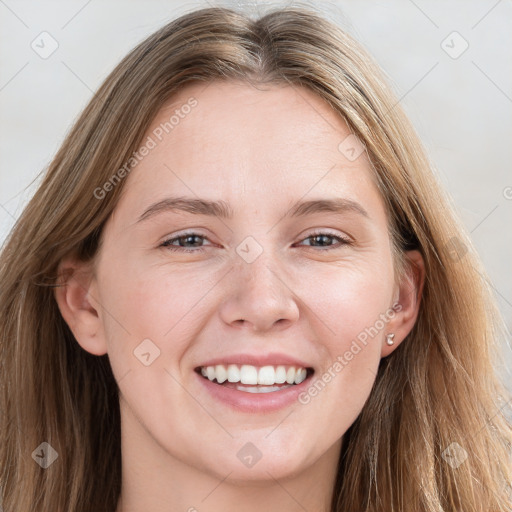 Joyful white young-adult female with long  brown hair and blue eyes