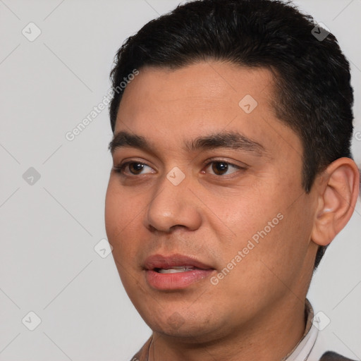 Joyful white young-adult male with short  black hair and brown eyes