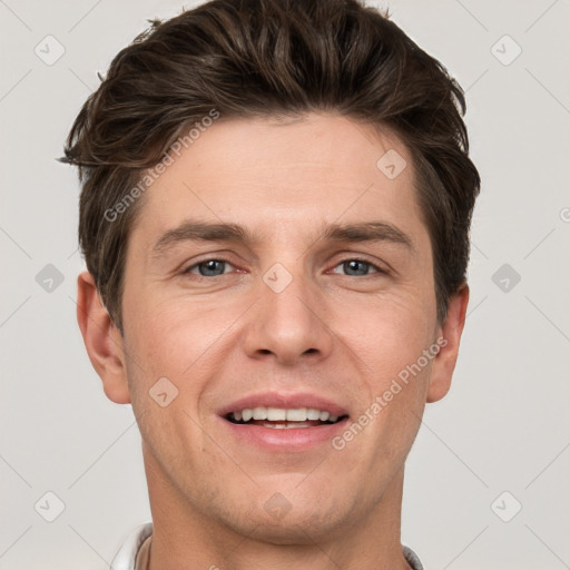 Joyful white adult male with short  brown hair and grey eyes