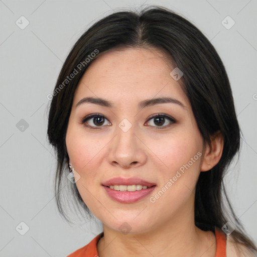 Joyful white young-adult female with medium  black hair and brown eyes