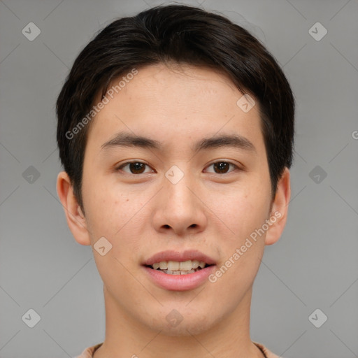 Joyful asian young-adult male with short  brown hair and brown eyes