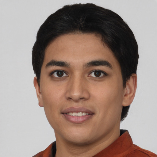 Joyful asian young-adult male with short  brown hair and brown eyes