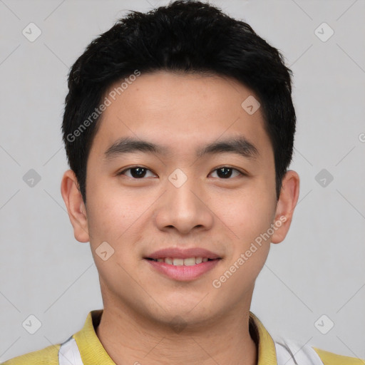 Joyful asian young-adult male with short  black hair and brown eyes
