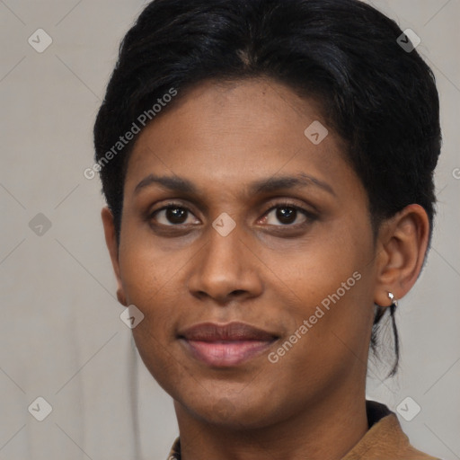 Joyful latino young-adult female with short  black hair and brown eyes