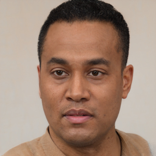 Neutral latino young-adult male with short  black hair and brown eyes