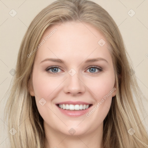 Joyful white young-adult female with long  brown hair and blue eyes