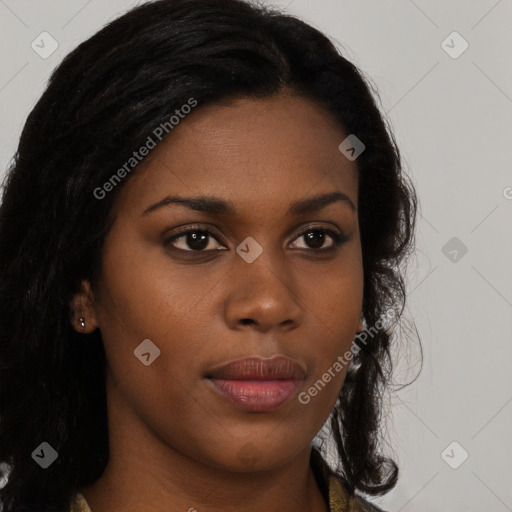 Joyful black young-adult female with long  black hair and brown eyes