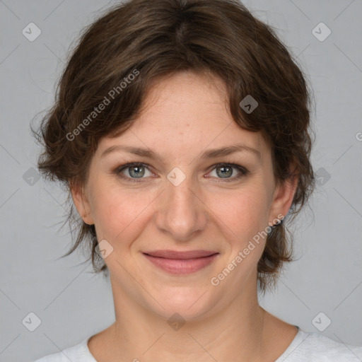 Joyful white young-adult female with medium  brown hair and green eyes