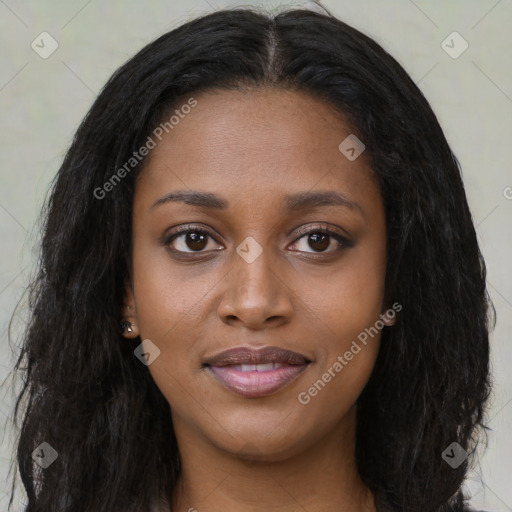 Joyful black young-adult female with long  brown hair and brown eyes