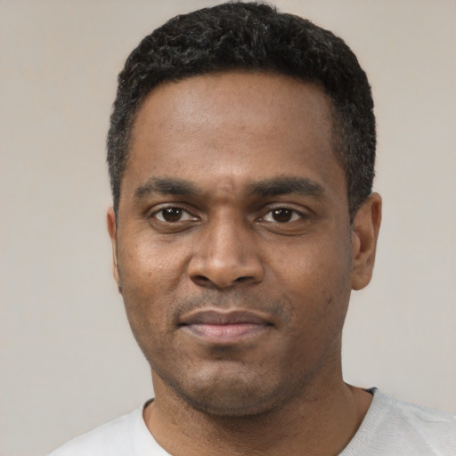 Neutral black young-adult male with short  black hair and brown eyes