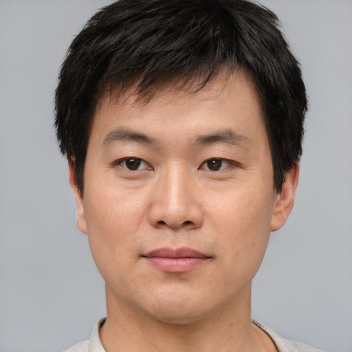 Neutral asian young-adult male with short  black hair and brown eyes