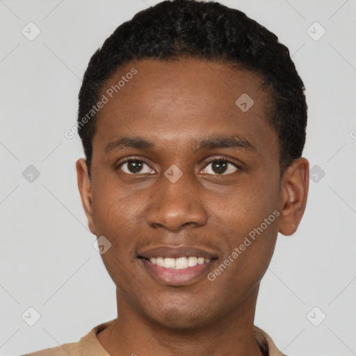 Joyful black young-adult male with short  black hair and brown eyes