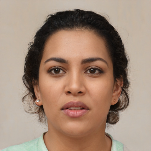 Neutral latino young-adult female with medium  brown hair and brown eyes