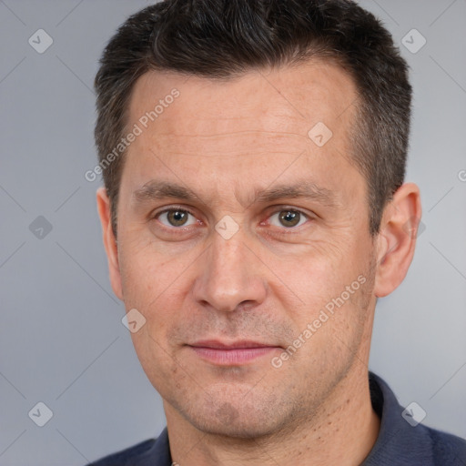 Joyful white adult male with short  brown hair and brown eyes