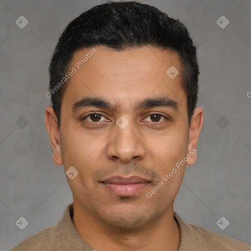 Joyful latino young-adult male with short  black hair and brown eyes