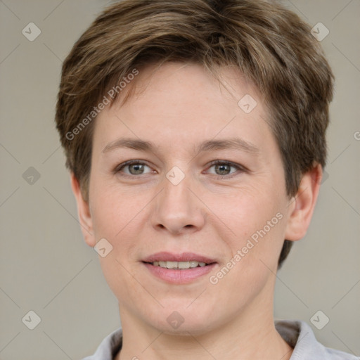 Joyful white adult female with short  brown hair and grey eyes