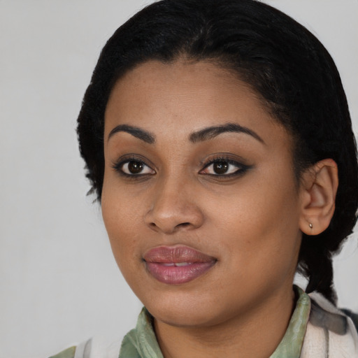 Joyful latino young-adult female with short  black hair and brown eyes